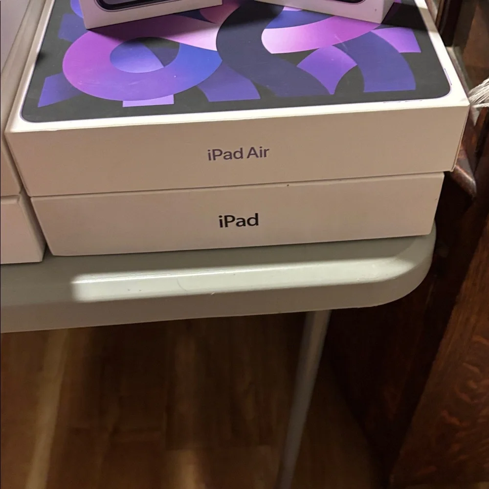 2 Apple iPhone, AirPods, iPad, iPad Air, 1 Pencil, 3MacBook Air 9 Empty Boxes.
